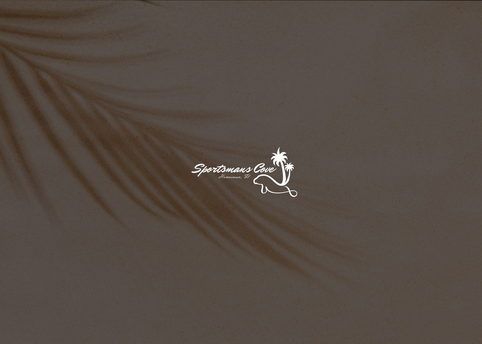 Sportsmans Cove logo over sand with palm shadow